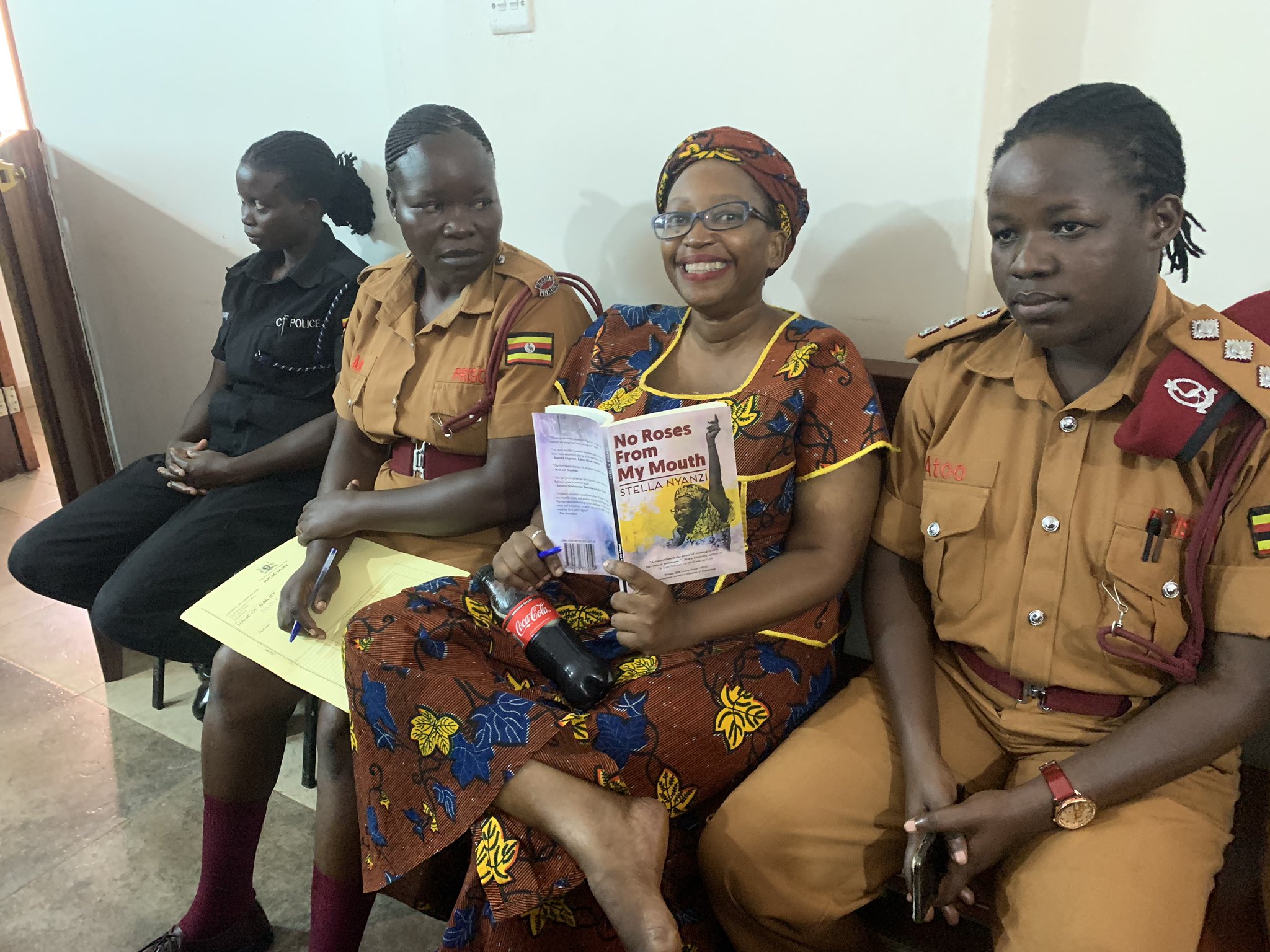 Acquitted Ugandan activist faints amid disorder at court