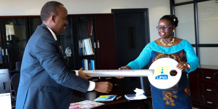 Doris Akol hands over office to new URA Commissioner-General