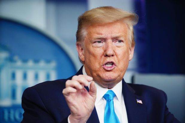 Trump signs order on immigration green card suspension