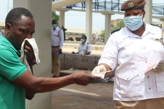 Nigerians with no masks face arrest in virus hot-spot
